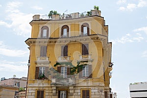 Old building facade with windows in Rome