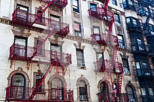 Old building with fire escape stairs in Soho, NYC