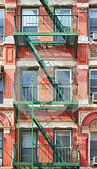 Old building with green fire escape, New York City, USA