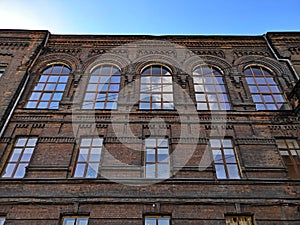 Old building with large Windows, red brick