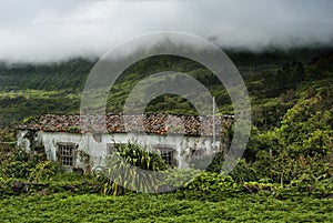 Old building and mountains of flores, acores photo