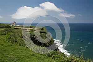 Old building overlooks the sea in the Azores photo