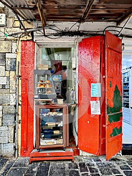 Old building with red wooden doors in the capital of Mauritius Port Louis.