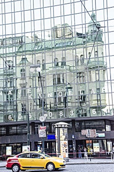 Old building reflection on skysraper