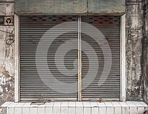 Old building with a rusty roller shutter door