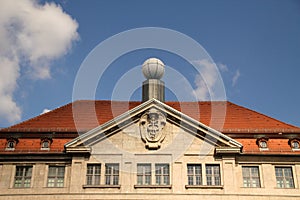 an old building with a sphere on the top of the roof