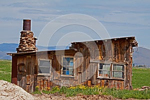 An Old Building With A Unique Chimney