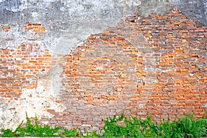 The old building wall that has a slag of cement makes the brick behind.exterior brick walls old buildings decorated with plaster