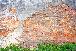 The old building wall that has a slag of cement makes the brick behind.exterior brick walls old buildings decorated with plaster photo
