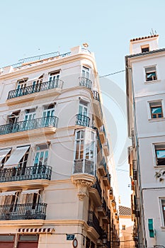 Old building wall in the streets of the city of Valencia. Windows and balconies. Spain.