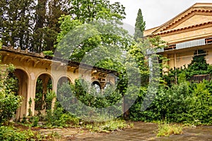 Old buildings in Abkhazia overgrown with grass and greenery