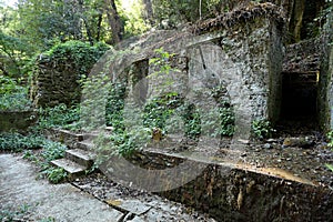 Old buildings in the ancient abandoned mines of Calferro in the archaeological mining park of Mulina di Stazzema, Tuscany.