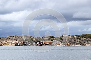 Old buildings and boats at the skerry coast near Bovallastrand Sweden