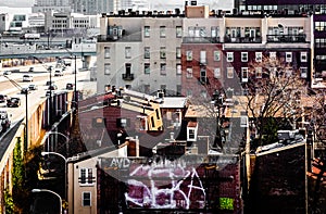 Old buildings and the Delaware Expressway, seen from the Ben Franklin Bridge Walkway in Philadelphia, Pennsylvania.