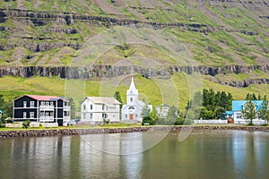 Old buildings near the lake in town of Seydisfjordur in Iceland