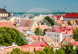 Old buildings at the Old Town, harbor and downtown in Tallinn, Estonia, viewed from above on a sunny day in the summe