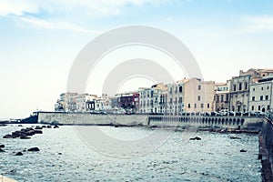 Old buildings in seafront of Ortygia Ortigia Island, Syracuse, traditional architecture of Sicily, Italy