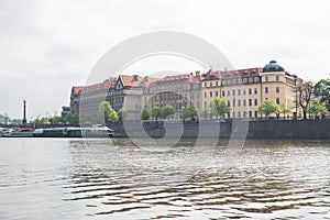 Old  buildings and street view. Vltava river with glare. Travel photo 2019