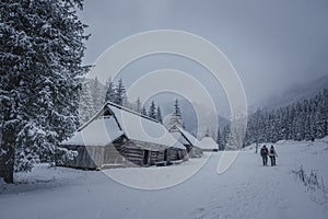 Old buildings and tourists in Tatra Mountains