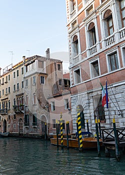 Old buildings in Venice. Canal view with boat.