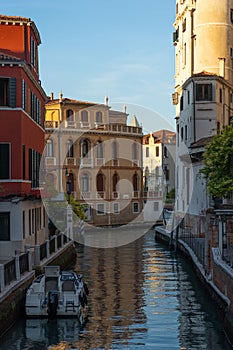 Old buildings in Venice. Canal view with boat.