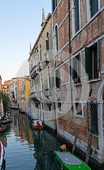 Old buildings in Venice. Canal view with boat