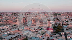 Old Bukhara city panorama in the rays of the setting sun, drone aerial