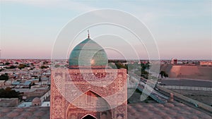 Old Bukhara city panorama in the rays of the setting sun, drone aerial