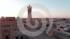 Old Bukhara city panorama in the rays of the setting sun, drone aerial