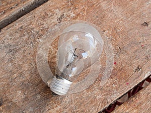 Old bulb on wooden background