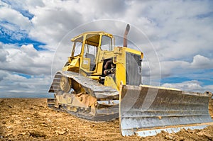 Old bulldozer Tractor on blue sky