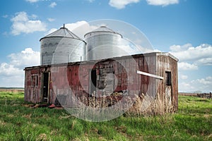 An old bunkhouse in green grass