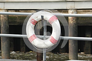 Old Buoy life hanging on the pier