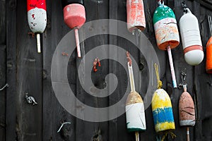 Old Buoys Hung on Side of Fishing Shack