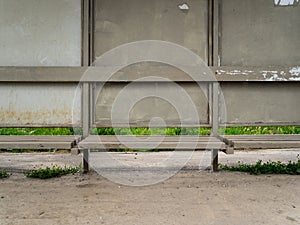 The old bus stop is grey. Very dusty and dirty bus stop