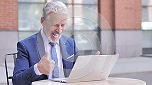 Old Businessman Celebrating Success on Laptop, Outdoor