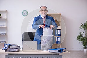 Old businessman employee rejecting new ideas with lots of papers