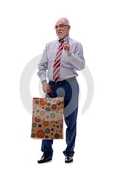 Old businessman holding bag isolated on white