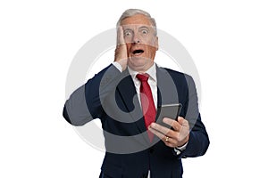 Old businessman slapping his face