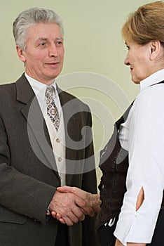 Old businessman thanked his worker photo