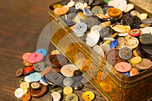 The old buttons. Buttons in an old metal box.