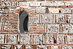Old Byzantium brick wall and window. Melnik fortress, Bulgaria
