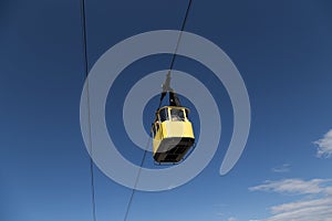 Old cable car cabin on blues sky