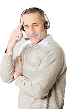 Old call center man wearing headset