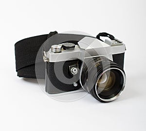 An Old Camera at an Angle with a Strap