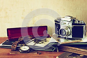 Old camera, antique photographs and old pocket clock
