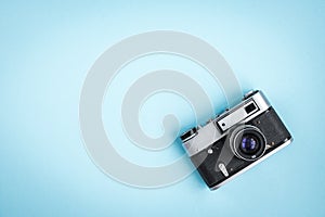 Old camera on blue background