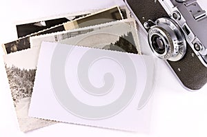 Old camera with empty photo frame