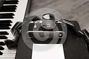 old camera, film, piano