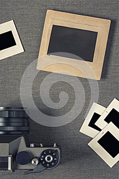 Old camera and negatives in paper frames